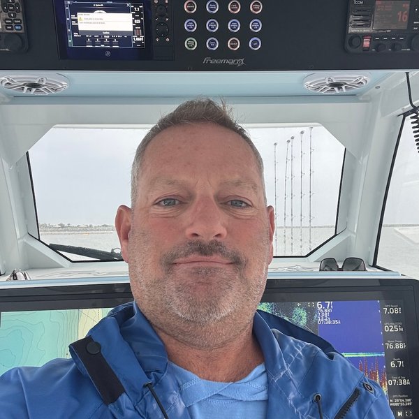 Gino Raymond DellaCava at the helm